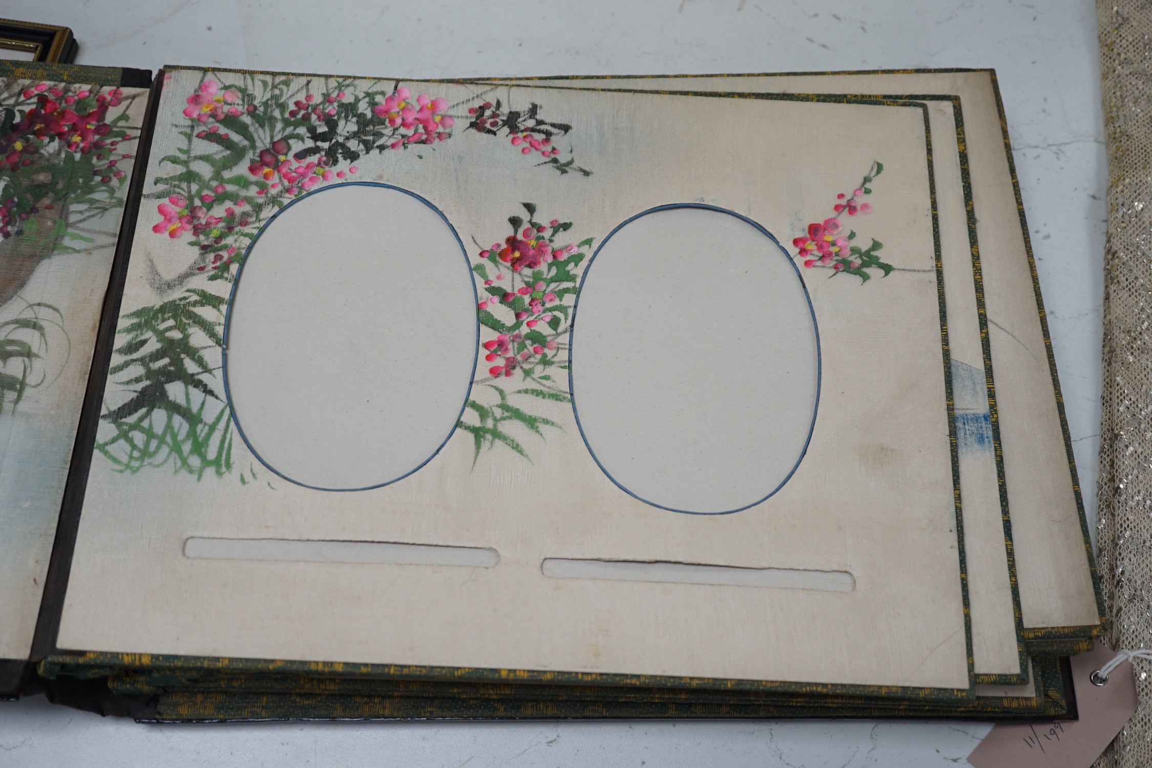 A Japanese shibayama style photograph album, vacant, 35cms wide x 27cms high